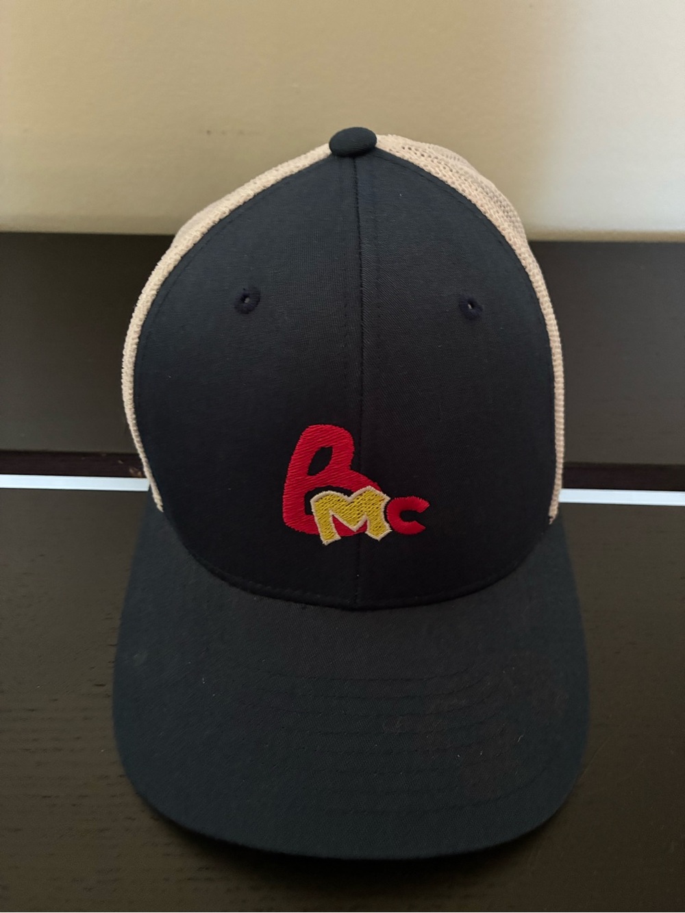Black Trucker Cap with Red and Yellow Embroidered Logo
